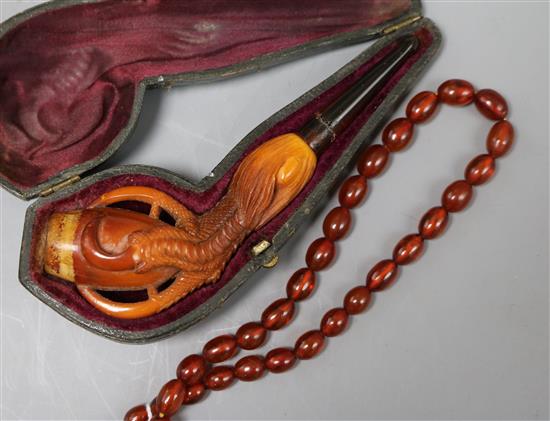 A Meerschaum pipe and bead necklace